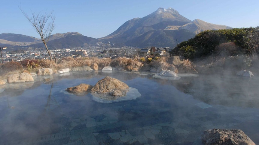A hot spring in Japan overlooking the mountains.