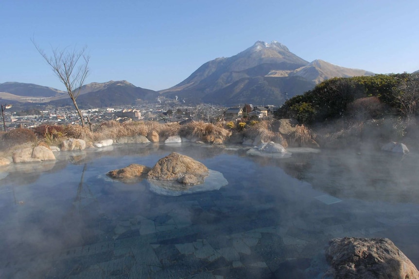 A hot spring in Japan overlooking the mountains.