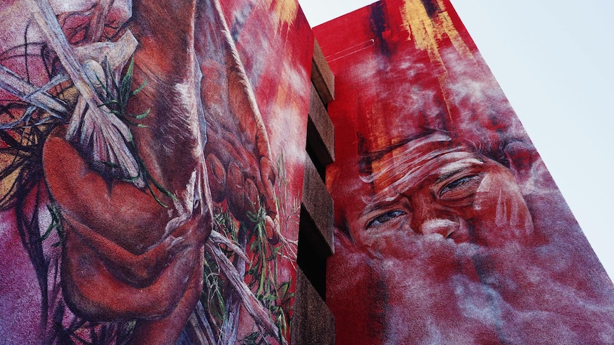indigenous painting in reds 
