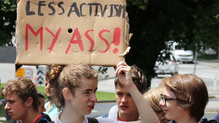 Two students holding placards at climate action rally, Hobart, 29 November 2018.