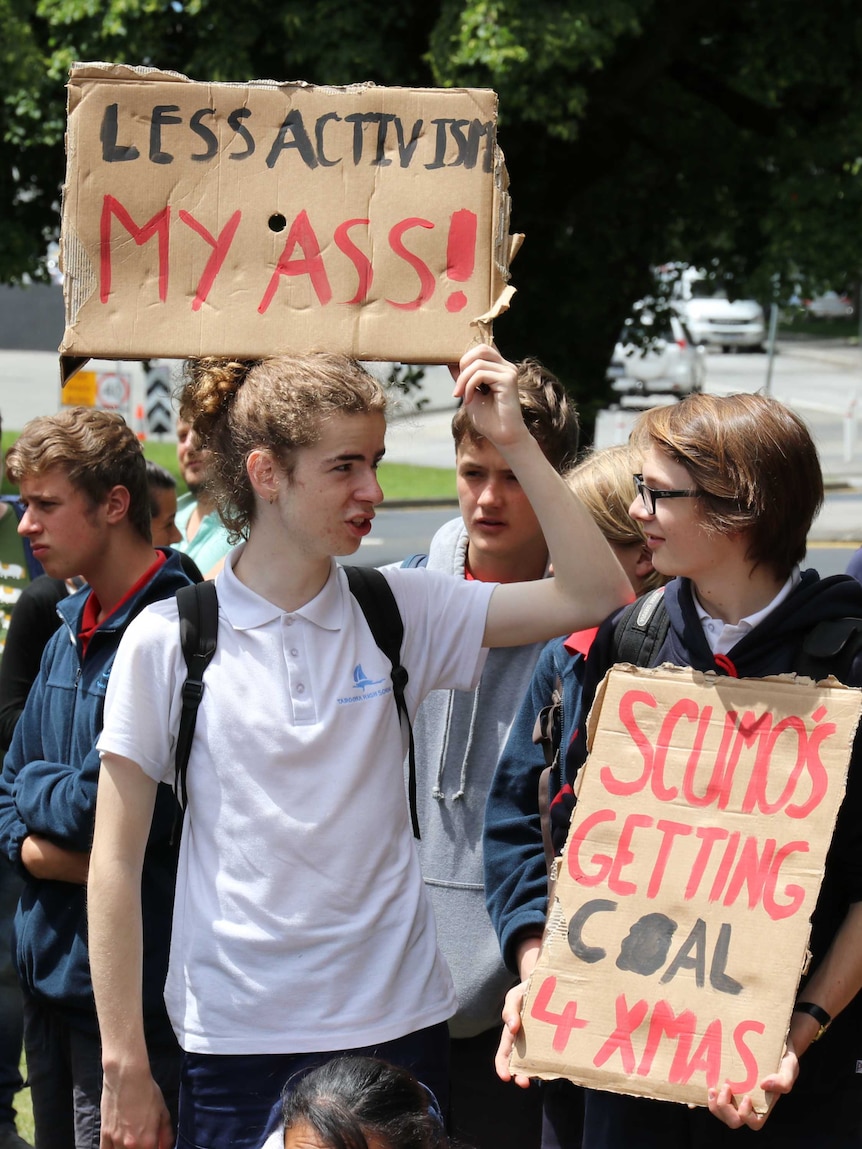 Two students holding placards at climate action rally, Hobart, 29 November 2018.