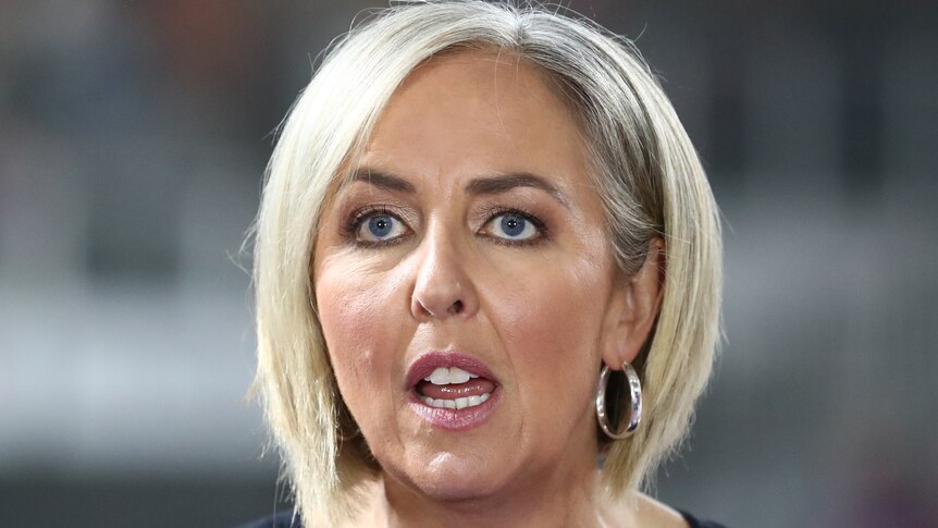 A headshot of Liz Ellis commentating on TV during a Super Netball game.