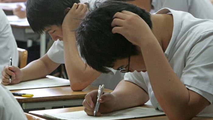 Students in Seoul take a mock college entrance test.