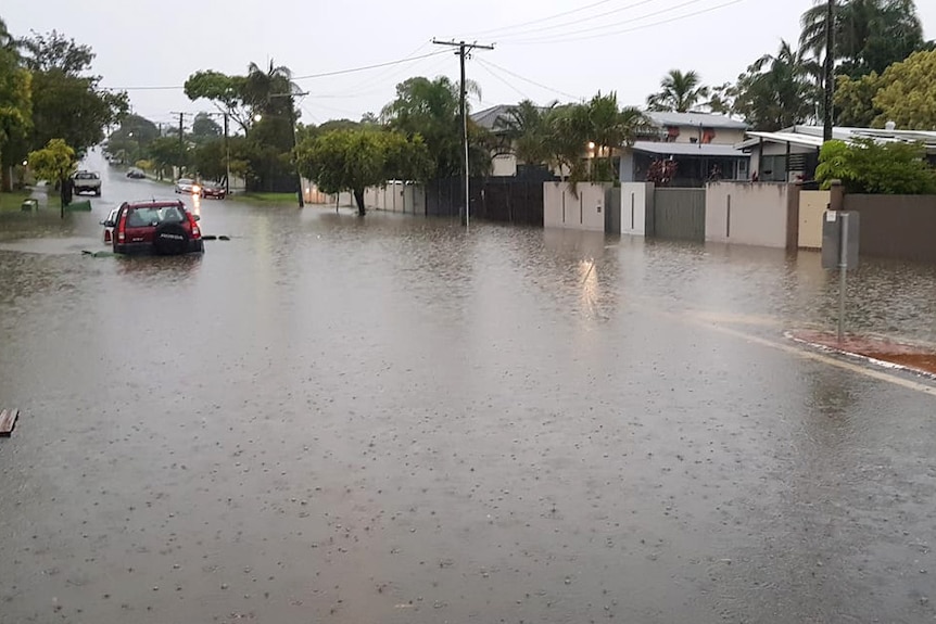 Cars parked on a flooded street