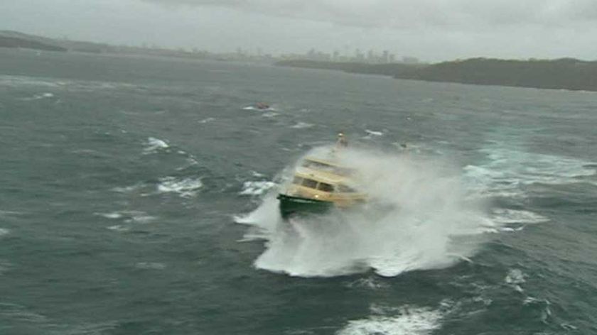 Wild weather: A ferry takes a beating in Sydney Harbour.