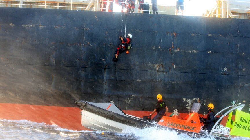 Greenpeace activists climb aboard the MV Meister on April 24, 2013.