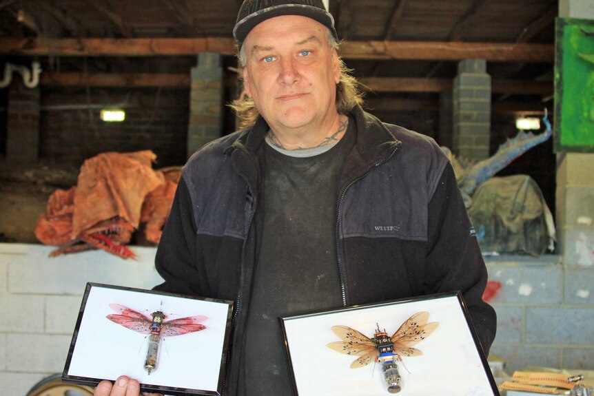 Steve Wakeling with mounted recycled bugs