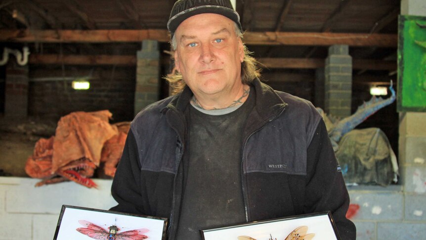 Steve Wakeling with mounted recycled bugs