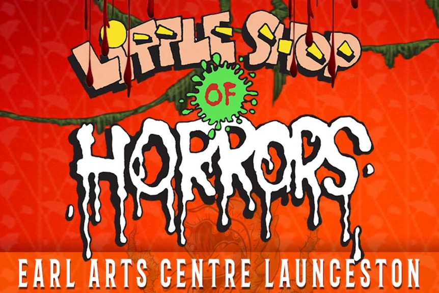 An orange and red poster for the production of Little Shop of Horrors. It features the name of the production. 