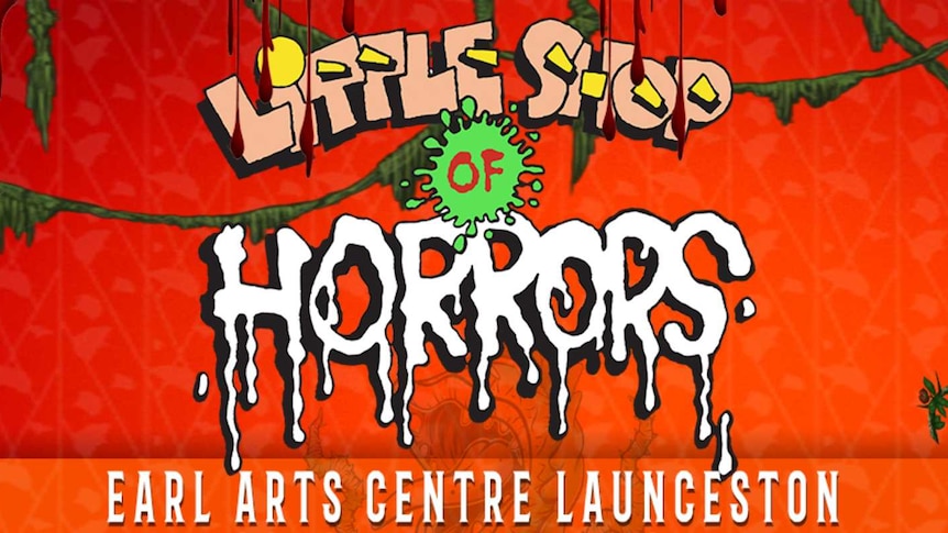 An orange and red poster for the production of Little Shop of Horrors. It features the name of the production. 