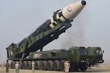General view of what state media reports is the "Hwasong-17" intercontinental ballistic missile (ICBM) on its launch vehicle.