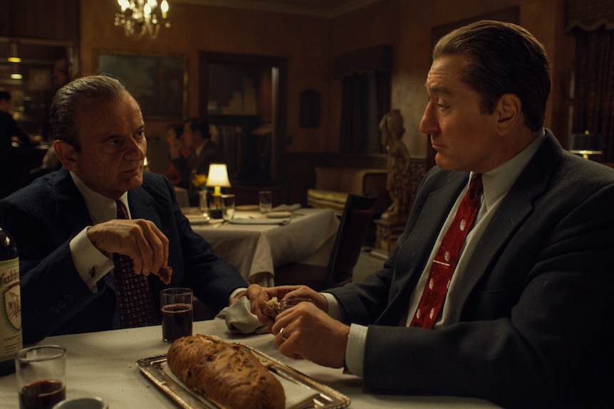 Actors Joe Pesci and Robert De Niro in an Italian restaurant in the 1950s in the film The Irishman