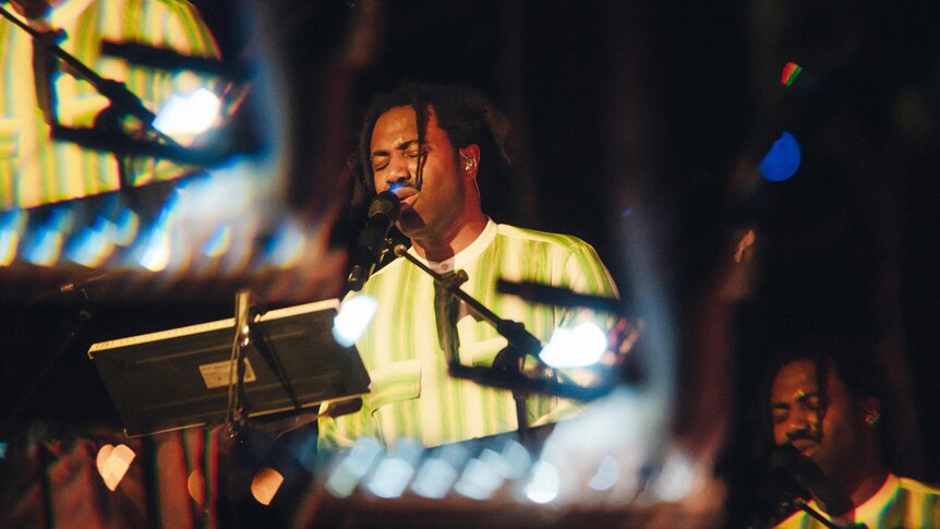 A kaliedoscopif photo of Sampha performing live at Sydney's Hordern Pavilion, 26 Feb 2024