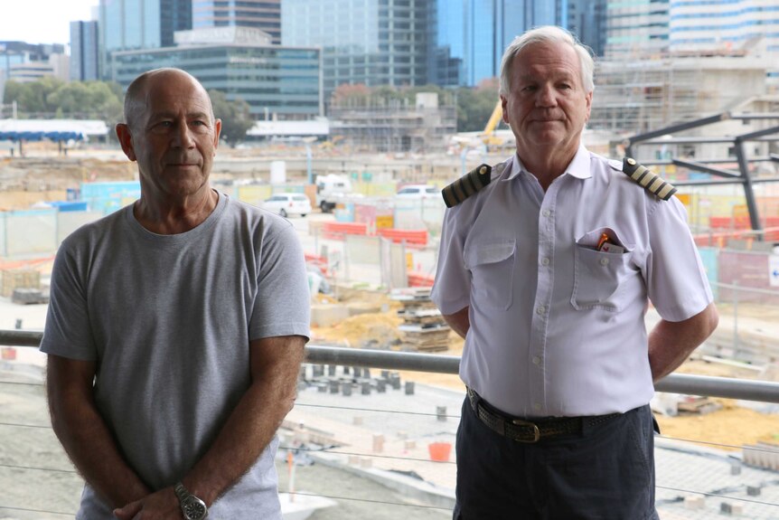 Barrack Street jetty business owners Riverside Bar and Restaurant owner Bryan Molnar (l) and Bill Edgar owner of Golden Sun Cruises in front of Elizabeth Quay construction site in Perth