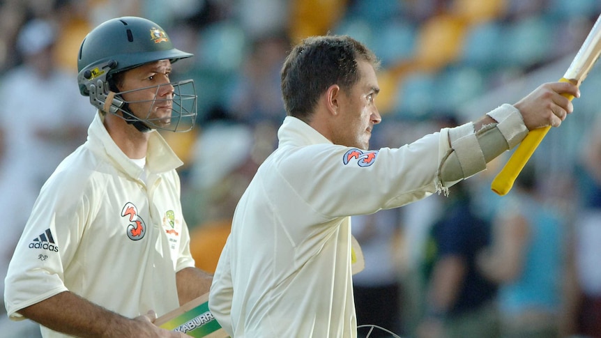 Australian cricketers Ricky Ponting and Justin Langer walk off the field