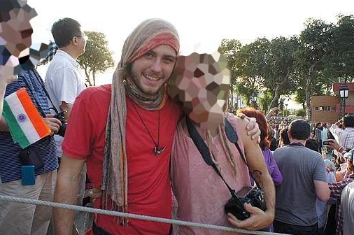 Cy Walsh, son of Adelaide Crows coach Phil Walsh, in a crowd with a scarf wrapped around his head, date and location unknown.