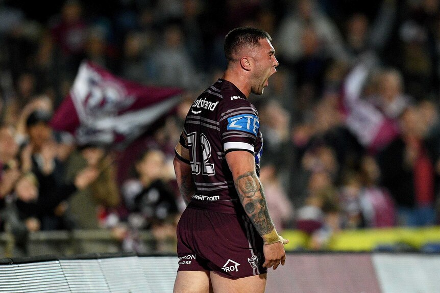 Curtis Sironen screams out after scoring a try for Manly.