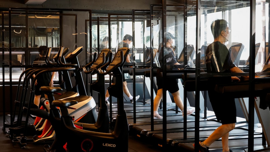Gym members use the treadmill amid the coronavirus disease (COVID-19) pandemic at a fitness club in Seoul, South Korea.