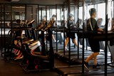 Gym members use the treadmill amid the coronavirus disease (COVID-19) pandemic at a fitness club in Seoul, South Korea.