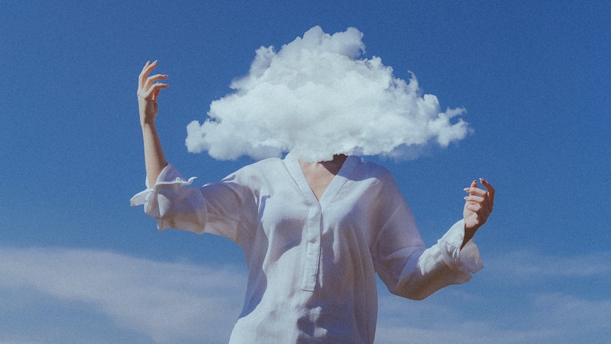 A person standing with their arms raised and their head replaced with a cloud.