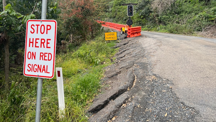 damaged road and road sign