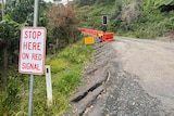 damaged road and road sign