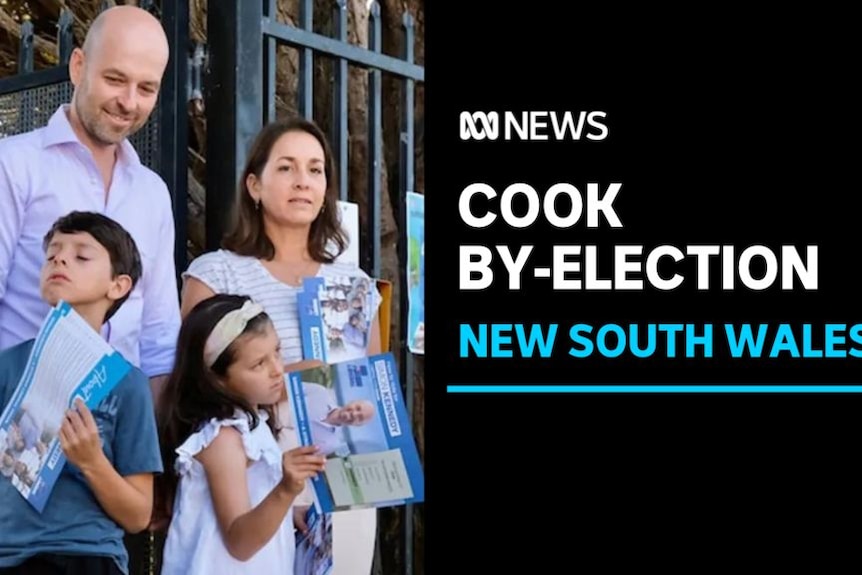 Cook By-Election, New South Wales: A man and a woman and two children stand together holding flyers.