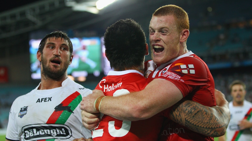One on the board ... Daniel Vidot and Nathan Green celebrate a Dragons try at the Olympic stadium.