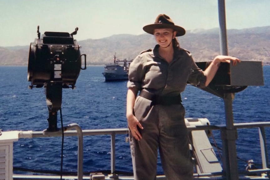 Sarah Miller stands on the flag deck of HMAS Tobruk during INTERFET operations in East Timor in 1999.