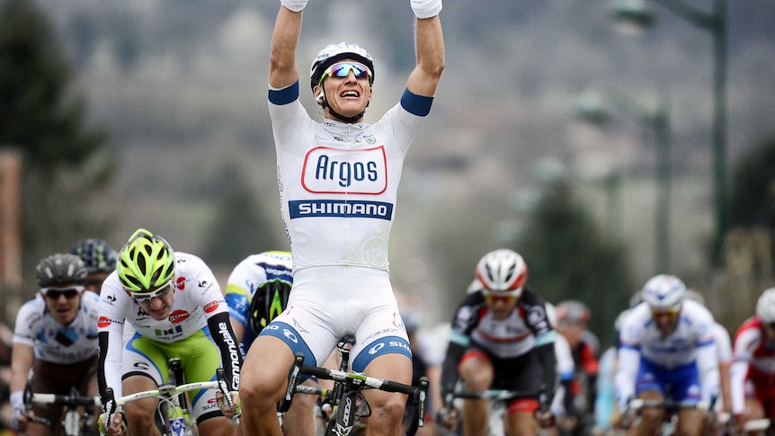 Second stage win ... Marcel Kittel celebrates in front of the chasing pack.