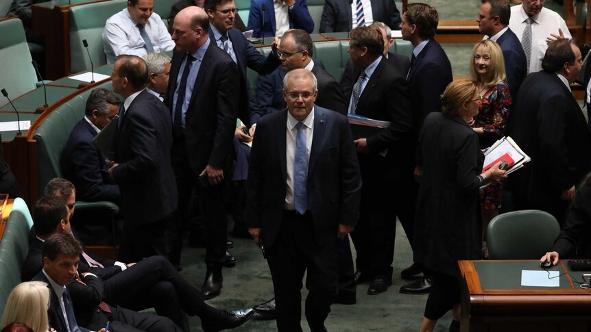 Prime Minister Scott Morrison walked through the House of Representatives and his colleagues walk in another direction