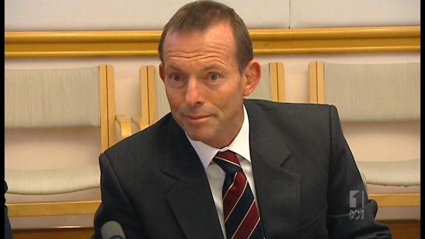 Abbott pounces on carbon tax admission