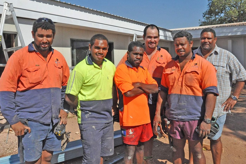 Workers at Napranum on Qld's western Cape York, with Dick Namai (2nd from right) and Mayor Philemon Mene (far right)