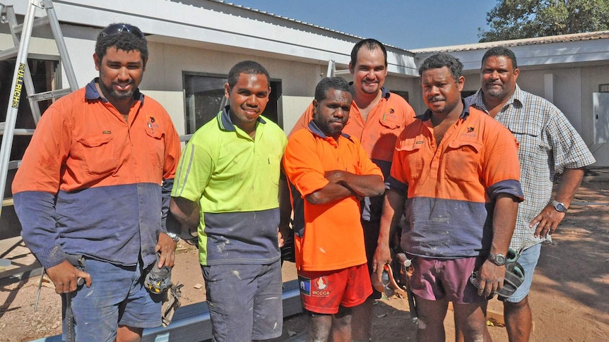 Workers at Napranum on Qld's western Cape York, with Dick Namai (2nd from right) and Mayor Philemon Mene (far right)