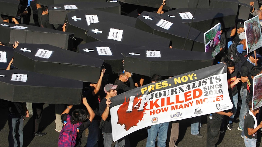 Filipino journalists rally to commemorate journalists killed in Maguindanao in 2009, November 23, 2012.