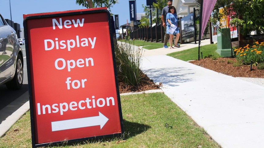 Display home open sign in street at a new housing estate.