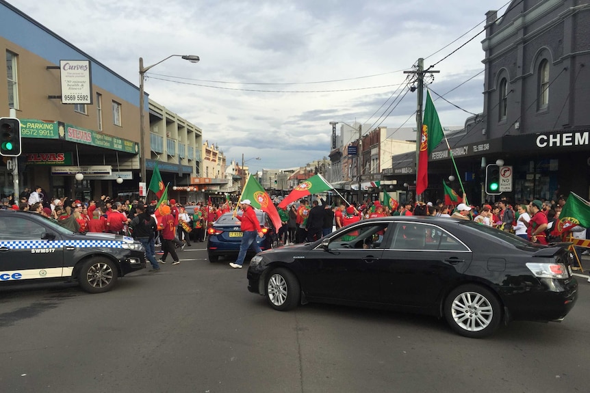 Portuguese fans line the streets of Sydney's Petersham.