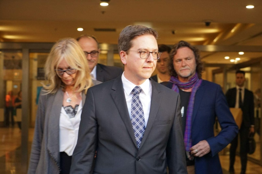 Thomas Zinn (centre) with Tori Johnson's parents.