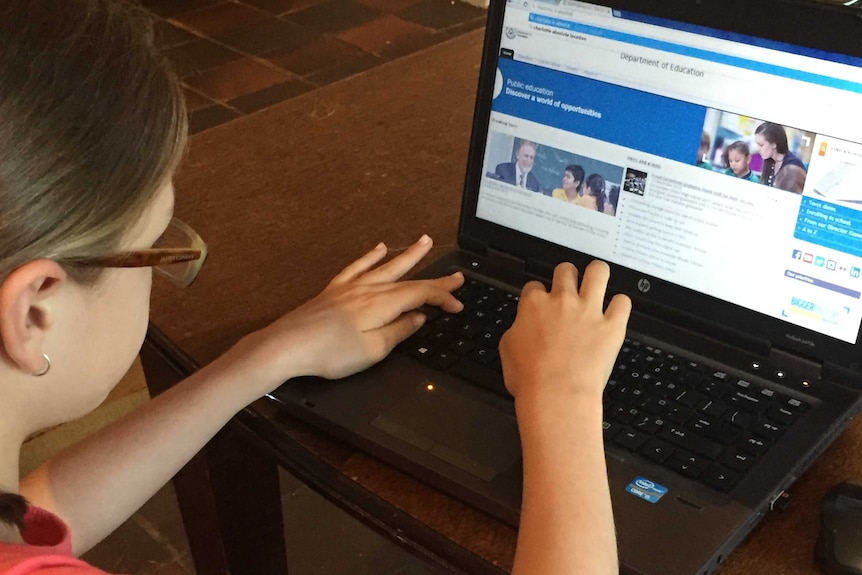 A child using a lap-top computer.