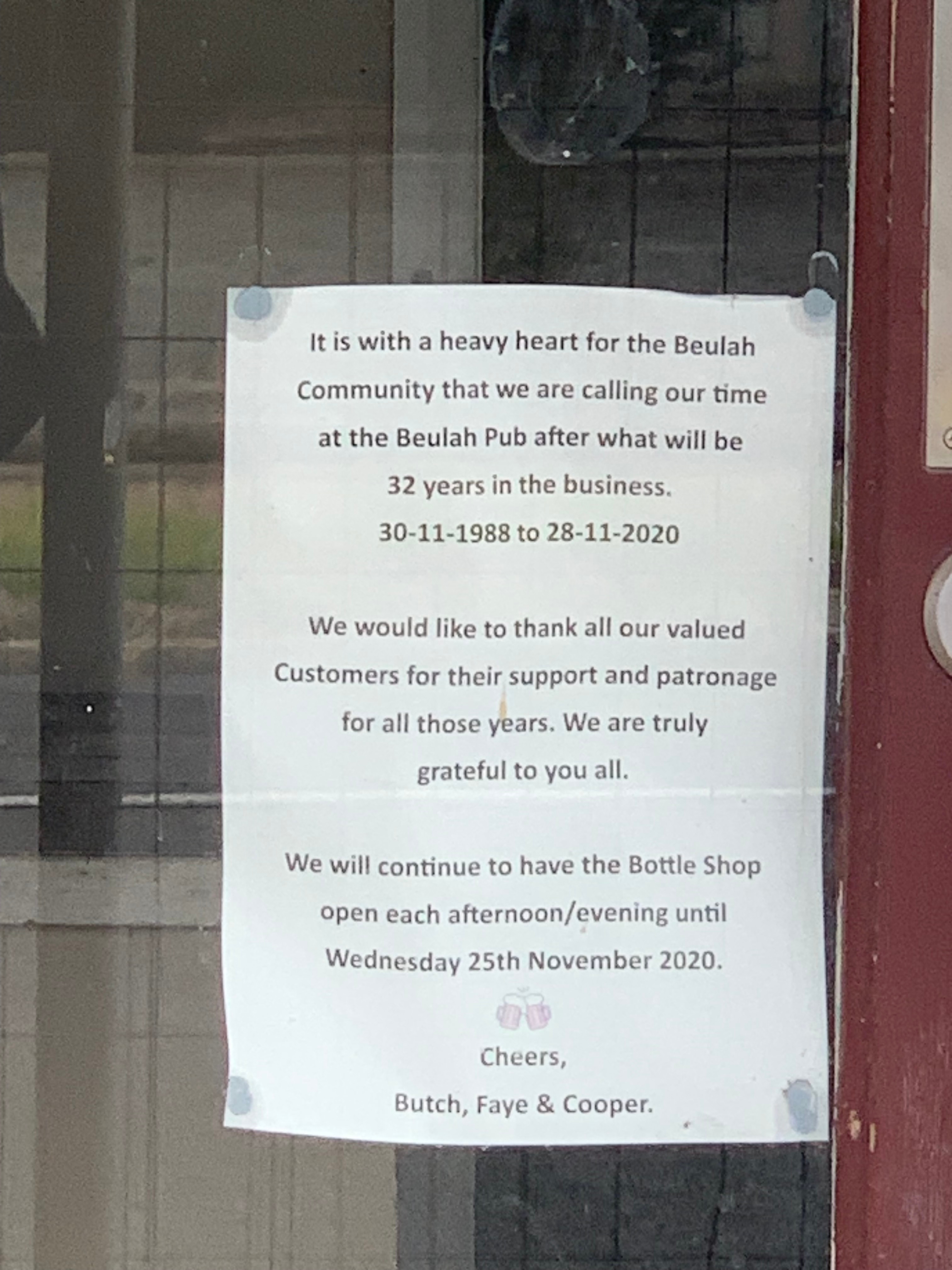 A notice on the front of a pub advising of its closure.