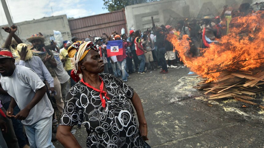 Demonstrators perform a voodoo ceremony prior to a march in Port-au-Prince.