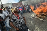 Demonstrators perform a voodoo ceremony prior to a march in Port-au-Prince.