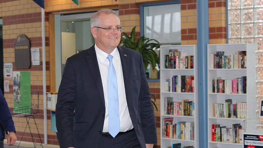 Prime Minister Scott Morrison waking in to a community centre in Albury