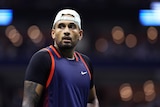 A subdued-looking Australia's Nick Kyrgios looks across court following a point at the US Open.