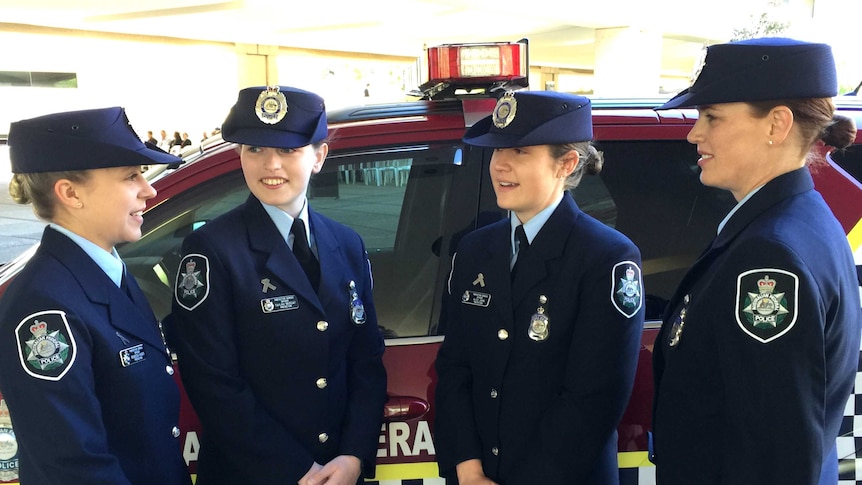 Four women in ceremonial police uniform.