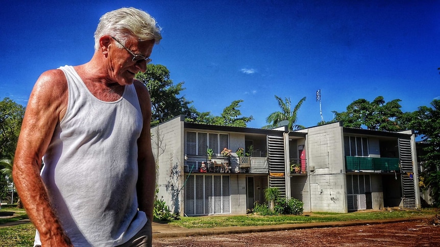 Loro Pekaj stands outside his public housing home in Nightcliff