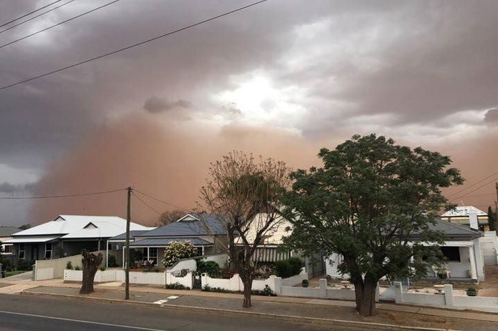 Dust storm moves over Broken Hill suddenly pushed by strong winds.