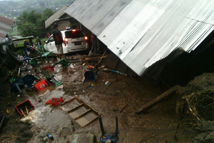 A car has fallen down an embankment during a landslide.