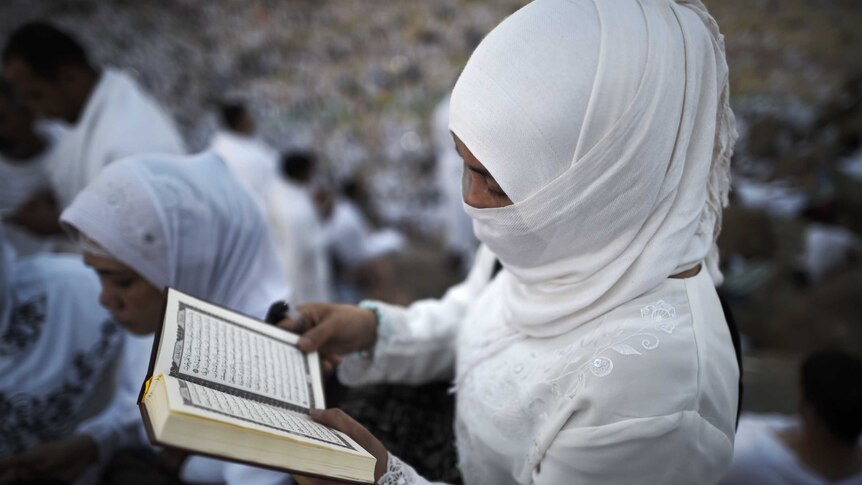 A lady takes part in one of the Hajj rituals on Mount Arafat