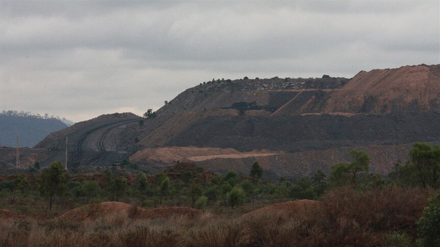 A coal mine in the outback on a bleak-looking day.